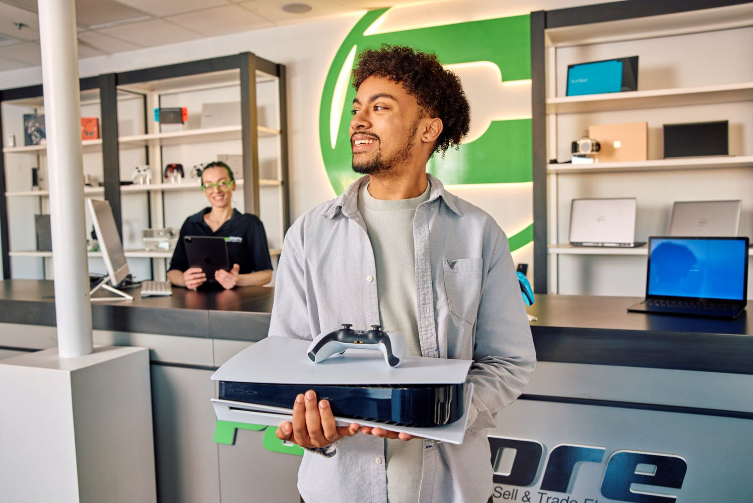 customer smiling after buying a gaming console